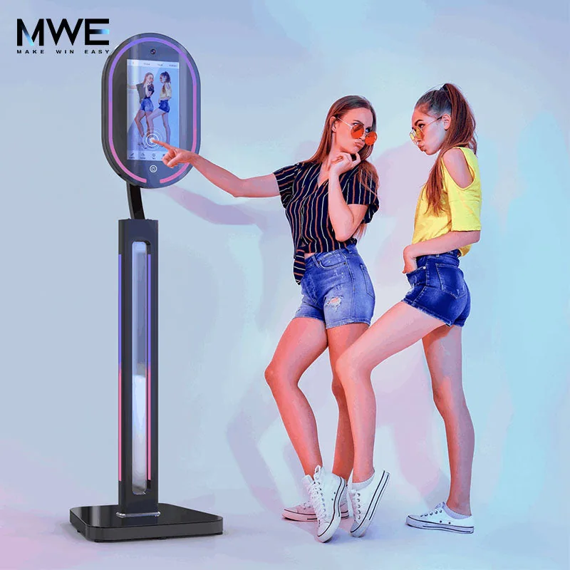 Guests posing in front of an MWE full-length mirror Photo Booth.